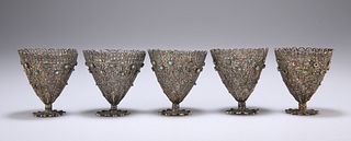 A SET OF FIVE WHITE METAL FILIGREE CUPS, probably Turkish, 