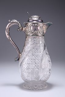 AN EDWARDIAN SILVER-MOUNTED CLARET JUG, by Walter & Charles