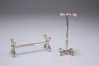 A PAIR OF GEORGE V SILVER KNIFE RESTS, by Harrison Brothers
