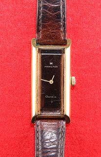 A LADYS GOLD-PLATED HAMILTON STRAP WATCH. Rectangular brown