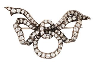 A DIAMOND RIBBON BOW BROOCH, set throughout with old-cut di