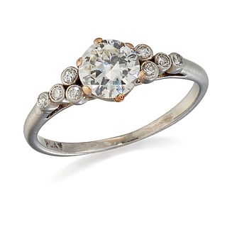 A SOLITAIRE DIAMOND RING, a translational-cut diamond in a 