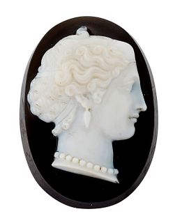 A SARDONYX CAMEO, of oval form and carved depicting a class