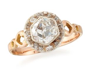 A SOLITAIRE DIAMOND RING, an old-cut diamond in a hexagonal