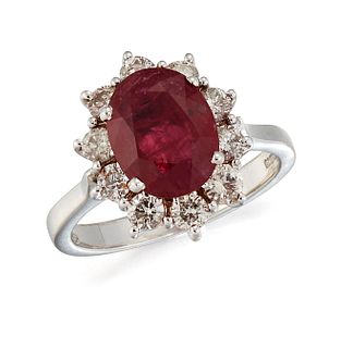 AN 18CT WHITE GOLD RUBY AND DIAMOND CLUSTER RING, an oval-c