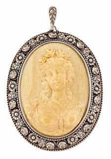 A GERMAN CARVED IVORY CAMEO BROOCH, an oval ivory plaque ca