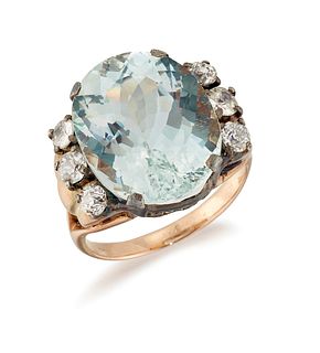 AN AQUAMARINE AND DIAMOND RING, an oval-cut aquamarine in a