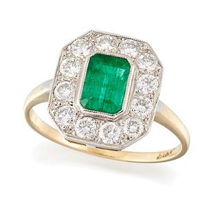 AN EMERALD AND DIAMOND RING, an octagonal-cut emerald in a 