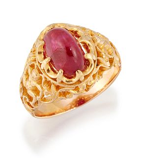 A MYANMAR (BURMA) RUBY RING, an oval cabochon ruby in a cla