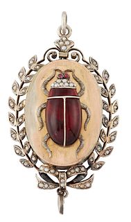 A RED GLASS AND SEED PEARL PENDANT, a beetle with red glass