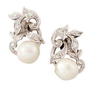 A PAIR OF CULTURED PEARL AND DIAMOND CLIP EARRINGS, the but