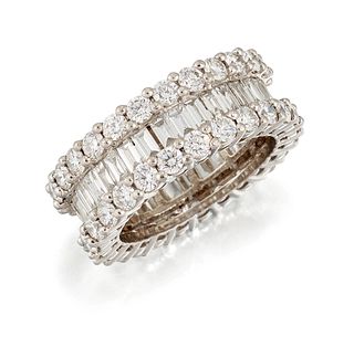 A DIAMOND ETERNITY RING, an inner band of channel-set bague