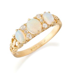 AN OPAL AND DIAMOND RING, three graduated oval opals in cla