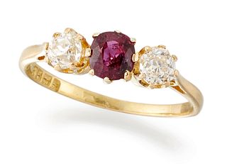 AN 18CT GOLD RUBY AND DIAMOND THREE STONE RING, an oval-cut