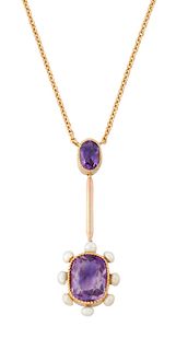 AN AMETHYST AND SEED PEARL PENDANT, an oval-cut amethyst in