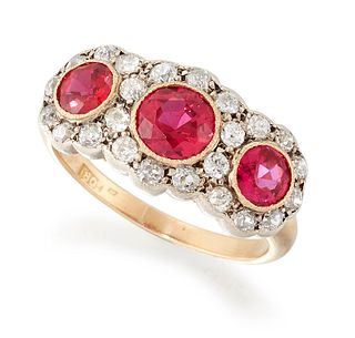A RUBY AND DIAMOND CLUSTER RING, three graduated round-cut 