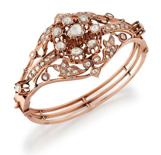 A DIAMOND BANGLE, a central cluster of rose-cut diamonds in