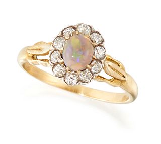 AN OPAL AND DIAMOND CLUSTER RING, an oval opal in a claw se