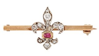 A DIAMOND AND RUBY FLEUR DE LIS BROOCH, set with old-cut di