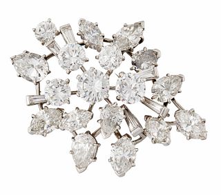 A DIAMOND BROOCH, BY CARTIER, set throughout with round bri