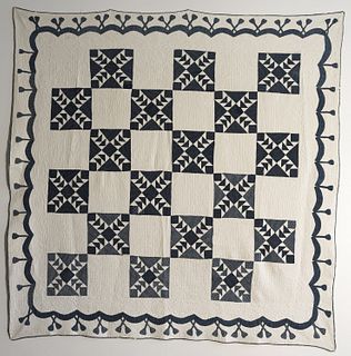 Blue and White Quilt with Swag Border