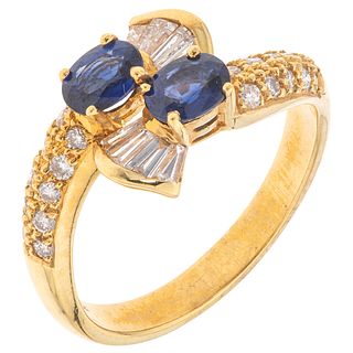 RING WITH SAPPHIRES AND DIAMONDS IN 18K YELLOW GOLD Weight: 4.4 g. Size: 7 2 Faceted oval cut sapphires ~ 0.60 ct 