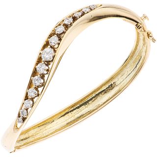 14K YELLOW GOLD DIAMOND BRACELET Rigid. Box clasp with 8-shaped safety. Weight: 23.5 g. Length: 6.1" (15.7 cm)
