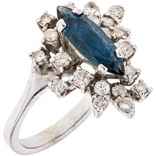 RING WITH SAPPHIRE AND DIAMONDS IN 18K WHITE GOLD Weight: 6.2 g. Size: 7 1 Marquise cut sapphire ~ 0.70 ct 20 D ...