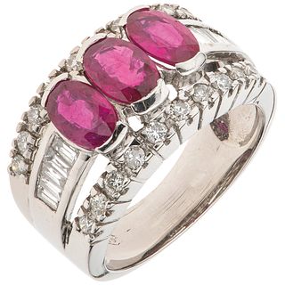 RING WITH RUBIES AND DIAMONDS IN 18K WHITE GOLD Weight: 6.9 g. Size: 5 ¼ 3 Rubies faceted oval cut ~ 1.20 ct ...