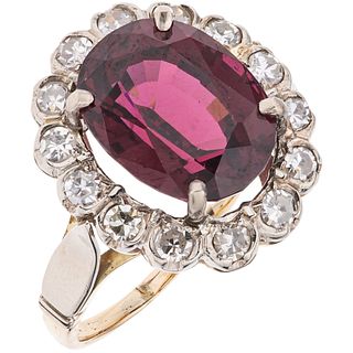 RING WITH GARNET AND DIAMONDS IN 10K YELLOW GOLD AND PALLADIUM SILVER Weight: 4.3 g. Size: 7 1 Garnet oval cut fac ...
