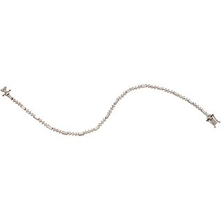 DIAMOND BRACELET IN 18K WHITE GOLD Box clasp with double eight-shape safety. Weight: 6.4 g. Length: 7.2" (18.3 cm)
