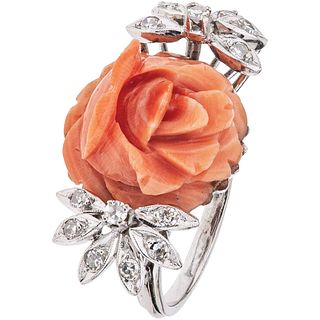 RING WITH CORAL AND DIAMONDS IN PALADIUM SILVER Weight: 7.7 g. Size: 8 1 Carved orange coral: 16.6 mm
