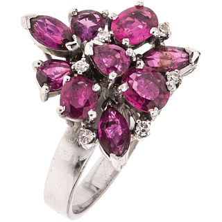 RING WITH RUBIES AND DIAMONDS IN SILVER PALLADIUM Weight: 6.1 g. Size: 7 ¼ 9 Rubies marquise cut, pear and faceted oval ...
