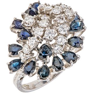 RING WITH SAPPHIRES AND DIAMONDS IN 18K WHITE GOLD Weight: 7.5 g. Size: 7 ¼ 15 Pear Cut Sapphires ~ 1.50 ct