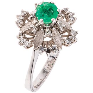 18K WHITE GOLD RING WITH EMERALD AND DIAMONDS Weight: 4.9 g. Size: 6½ 1 Emerald faceted round cut ~ 0.5  (chipped on the girdle)