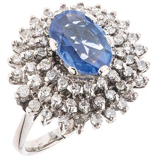 RING WITH SAPPHIRE AND DIAMONDS IN 14K WHITE GOLD Weight: 5.2 g. Size: 5 1 Faceted oval cut sapphire ~ 0.83 ct  (chipped on the crown)