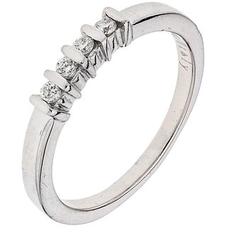 RING WITH DIAMONDS IN 14K WHITE GOLD Weight: 3.1 g. Size: 7 ¼ 4 Brilliant cut diamonds ~ 0.12 ct