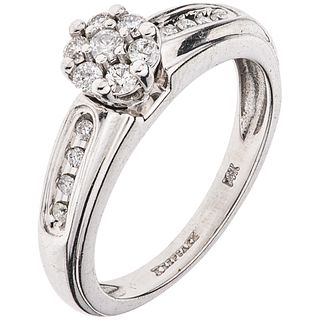 RING WITH DIAMONDS IN 14K WHITE GOLD Weight: 4.2 g. Size: 6 ¾ 15 Brilliant cut diamonds ~ 0.30 ct