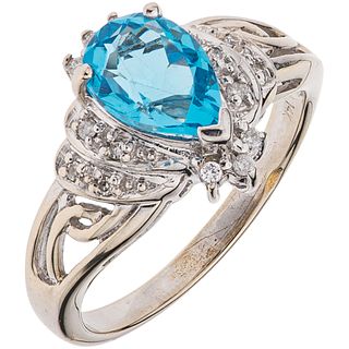 RING WITH TOPAZ AND DIAMONDS IN 14K WHITE GOLD Weight: 4.3 g. Size: 7 1 Pear cut topaz ~ 1.0 ct
