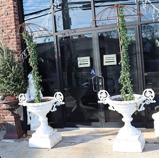 A Pair Of White Painted Cast Iron Urns With