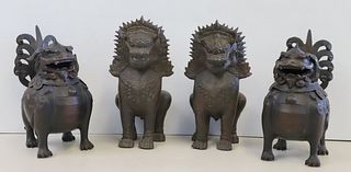 An Antique Pair Of Bronze Foo Lions Together With