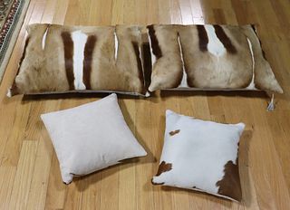 2 Pairs Of Hide Upholstered Cushions.