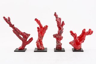FOUR RED CORAL NATURALISTIC TREE FORM SCULPTURES