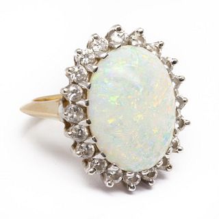 GIA opal Ring set with large cabochon opal surrounded by diamonds in 14k gold setting