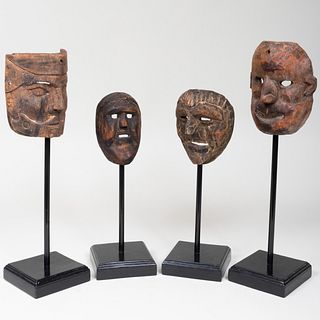 Group of Four Ethnographic Carved Wood Masks, Possibly Tibetan
