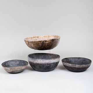 Three Black Painted Wooden Bowls and a Triangular Shaped Bowl