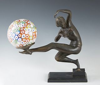 Art Deco Patinated Spelter Figural Lamp, 20th c., in the manner of Gerda Gerdago (1906-2004), of a dancer balancing a millefiore ball shade lamp on he