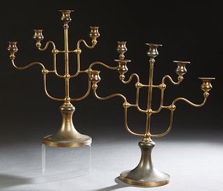 Unusual Pair of Brass Five Light Candelabra, 20th c, stamped E1635 on the underside, with a central straight candle arm, flanked by four curved candle