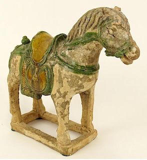 Chinese Ming Dynasty (1368-1644) Partially Glazed Pottery Figure Of A Saddled Horse.