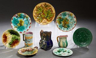 Group of Ten Pieces of French Majolica, 19th c., consisting of seven plates and three pitchers, Largest Pitcher- H.- 7 1/4 in., W.- 5 3/4 in., D.- 3 1